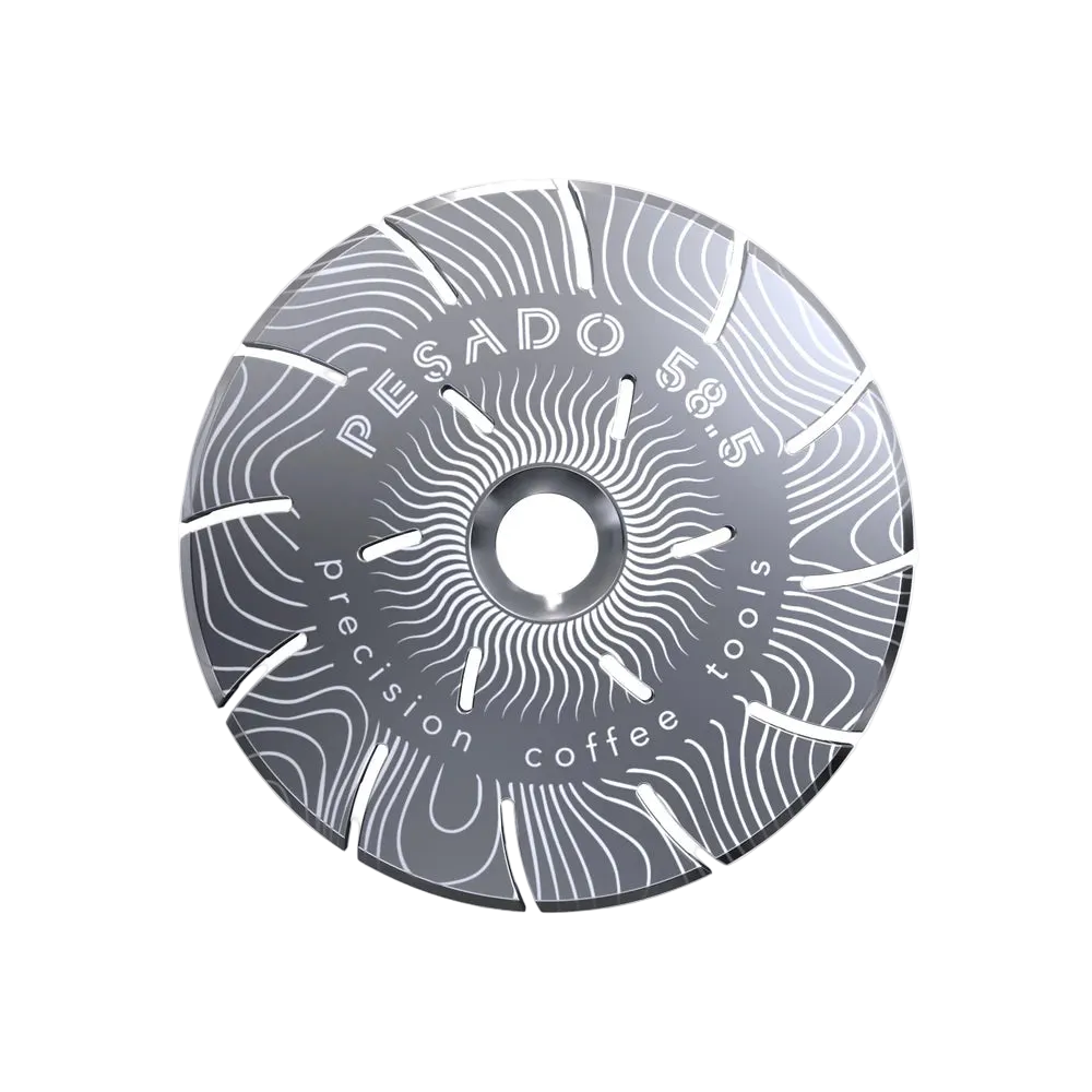 A circular metallic coffee grinder burr with a textured gray finish and white engraved text reading 'PESADO 58.5' and 'precision coffee tools', shown on a plain white background.